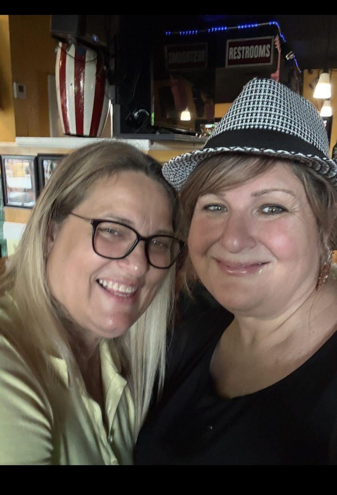 Owner and Stevi wearing the hat